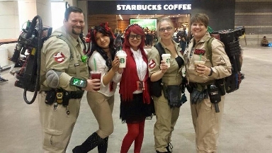 Mya at C2E2 2015, cosplaying as Grell Sutcliff from Black Butler, with a crew of Ghostbusters & a classmate dressed as a cat who's trying to purloin Mya's coffee